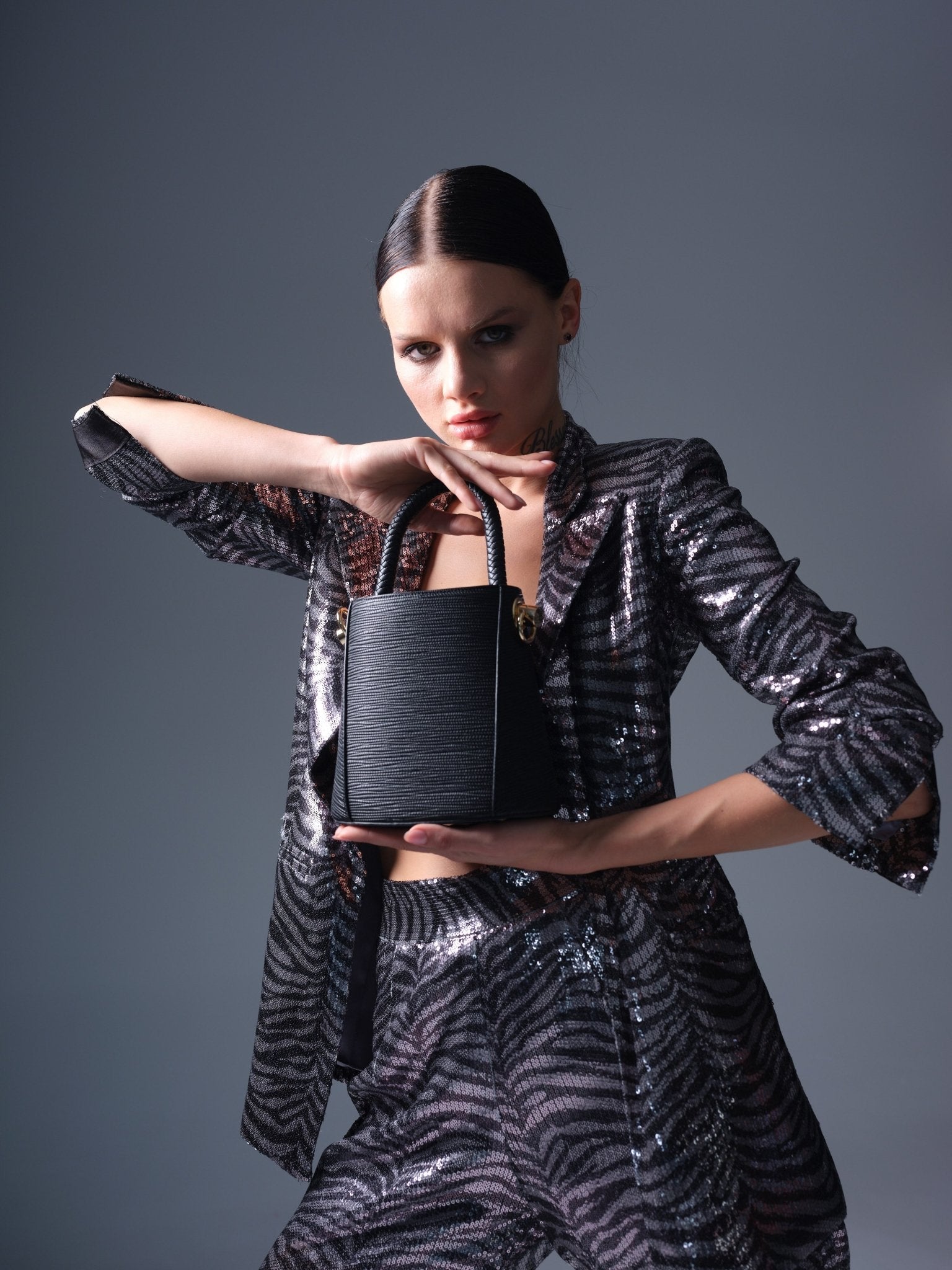 Black vegan leather bucket bag with braided handle