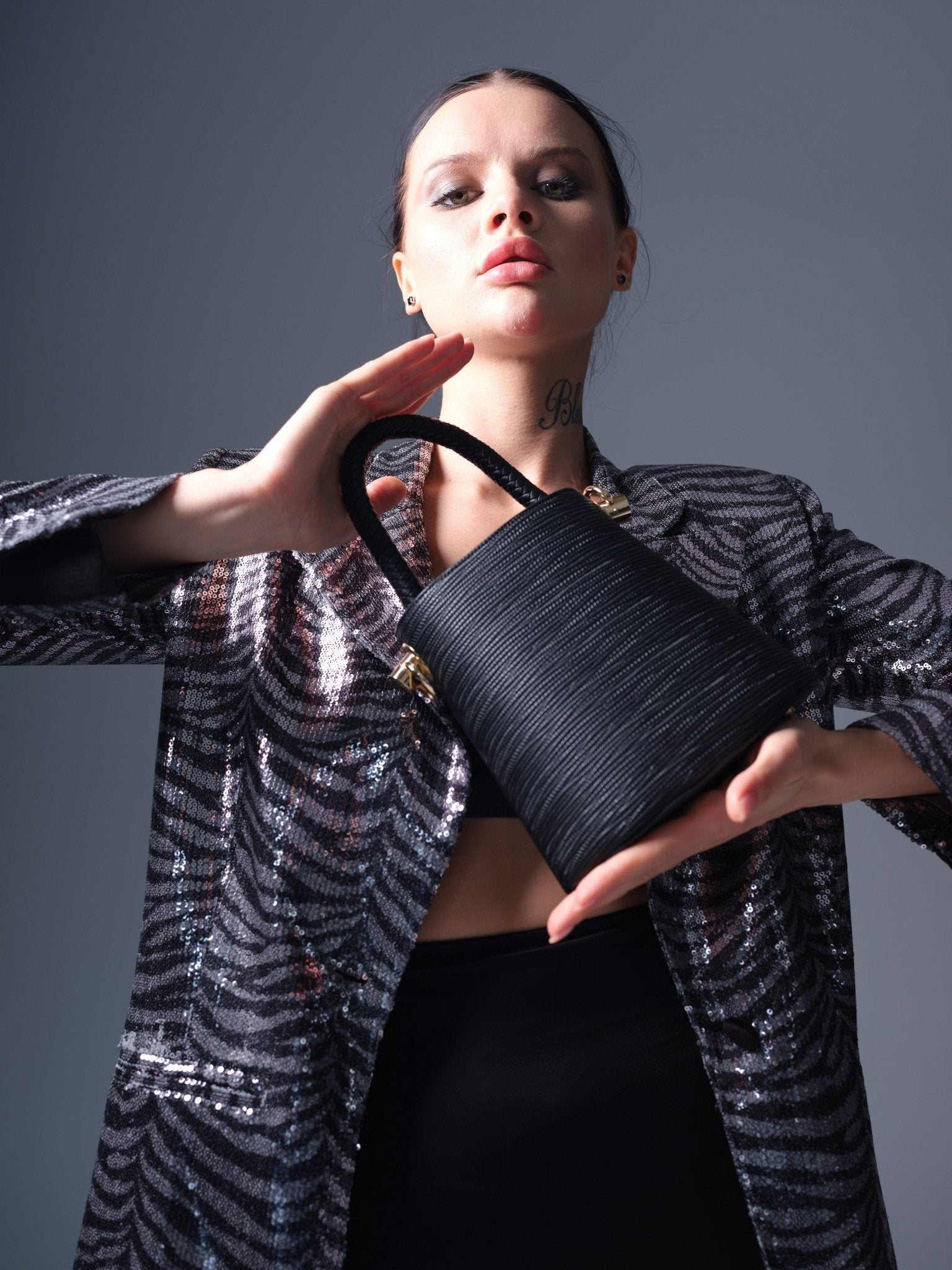 Black vegan leather bucket bag with braided handle